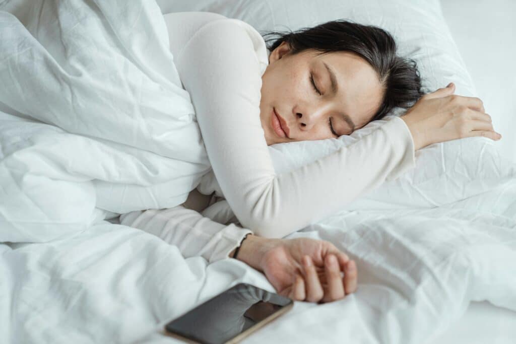 woman sleeping peacefully after acupuncture for insomnia