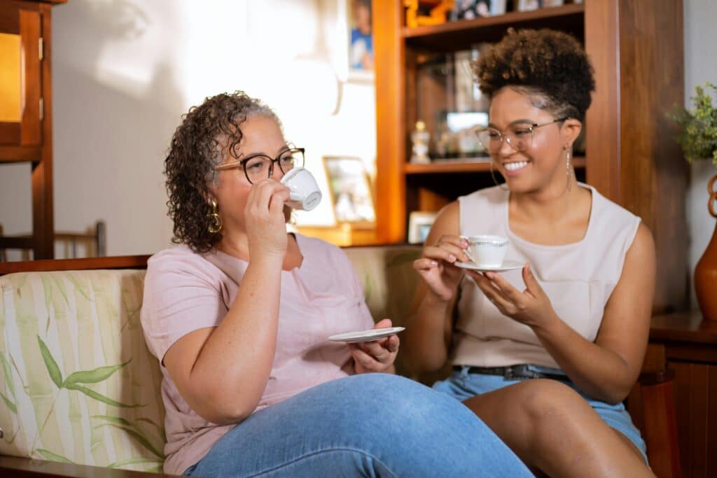 Woman drinking tea and feeling relief after perimenopause digestive issues